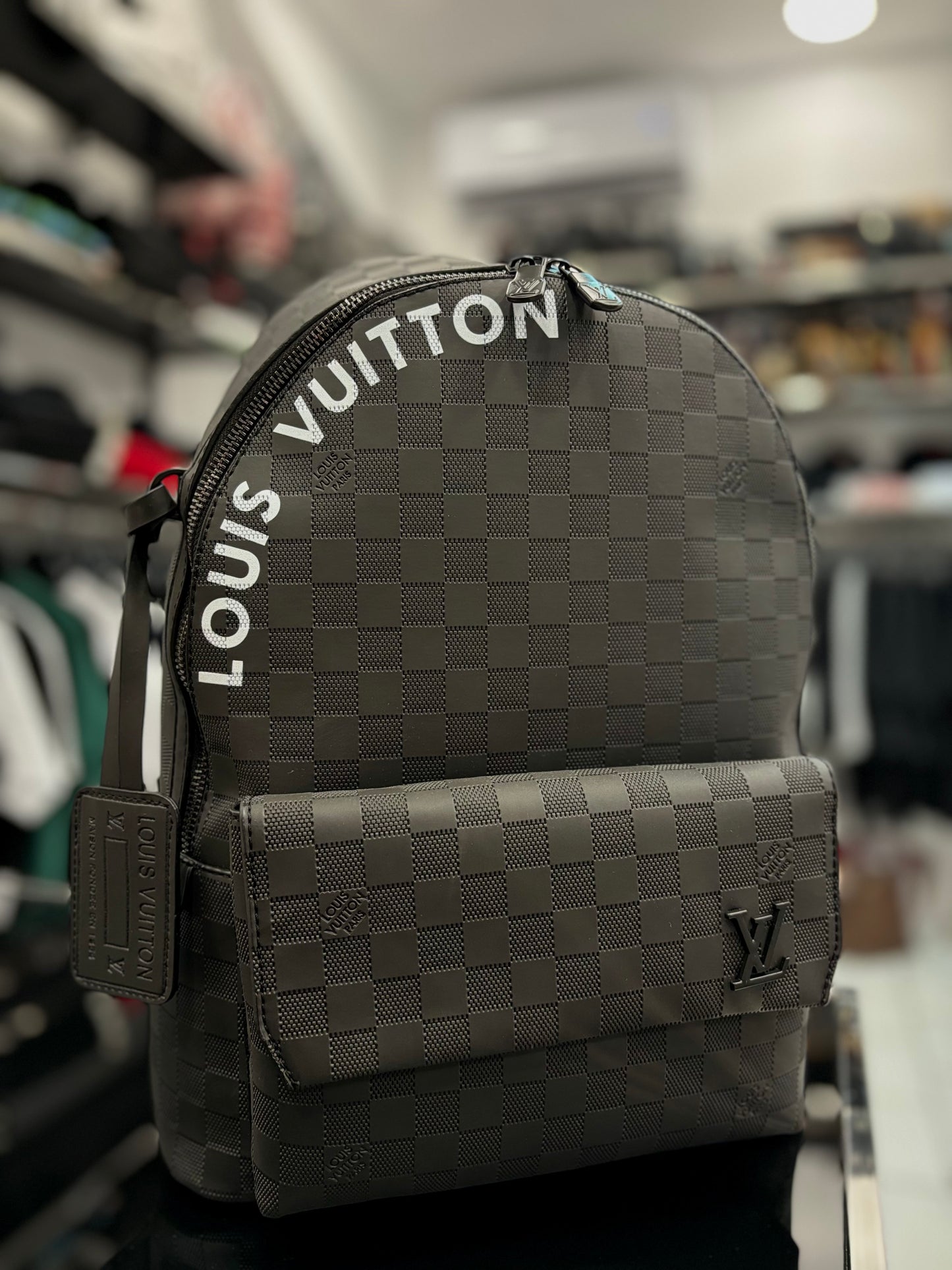 Background Louis Vuitton black backpack