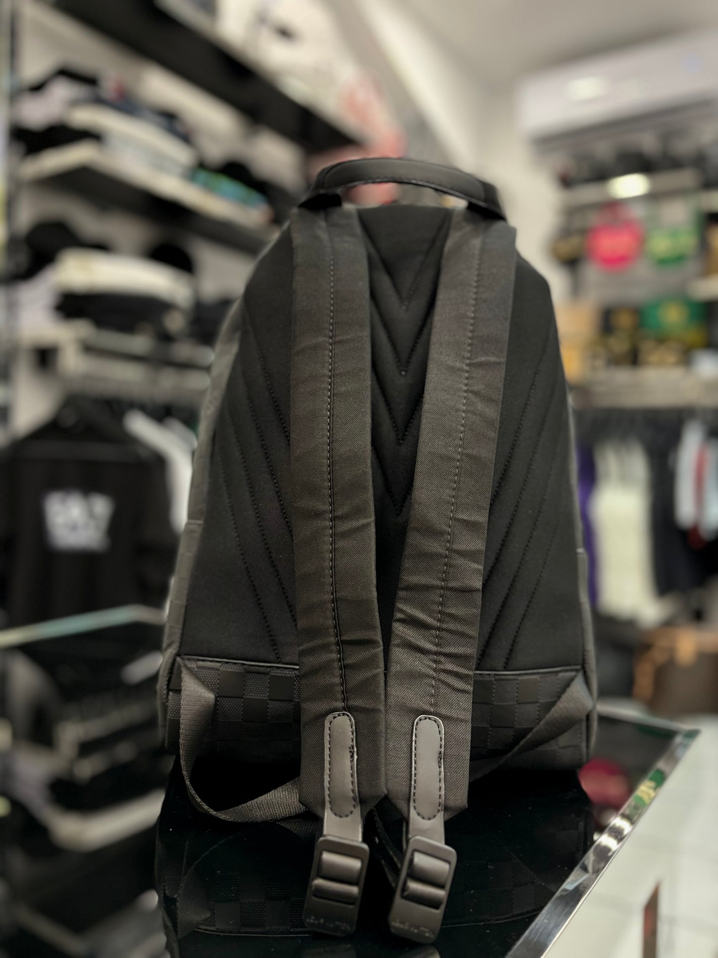 Background Louis Vuitton black backpack